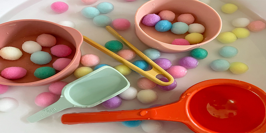 pom pom and water sensory tray